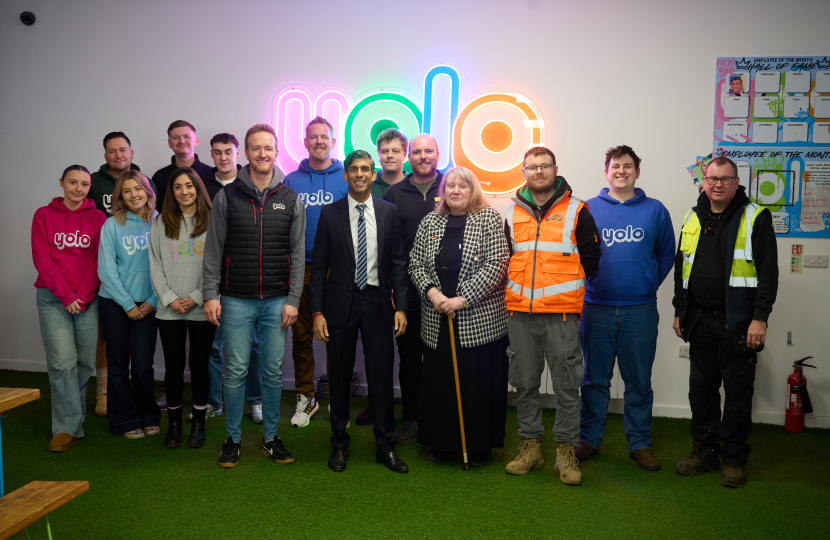 Rishi Sunak with staff at YOLO Inc