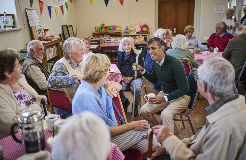 Rishi with residents
