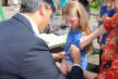 Rishi Sunak signs a leaver's shirt at Askrigg Primary School