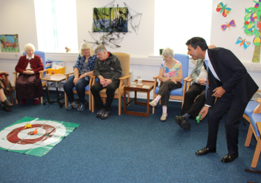 Rishi playing a game with clients at the Alzheimer's Society in Northallerton