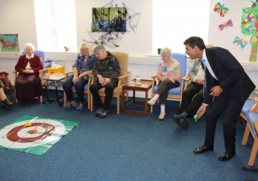 Rishi playing a game with clients at the Alzheimer's Society in Northallerton