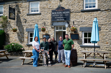 Rishi with the Bolton Arms team