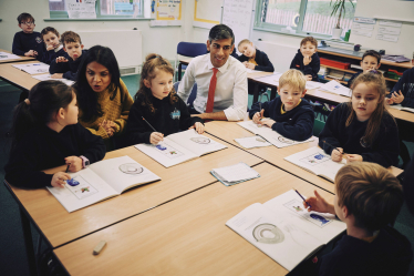 Rishi and Akshata with pupils