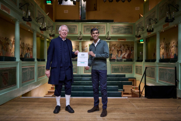 Rishi Sunak MP presenting TripAdvisor award to volunteer tour guide Gerry Broadbent